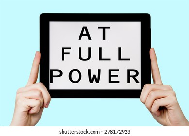 Tablet pc with text at full power  with blue background