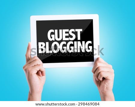 Tablet pc with text Guest Blogging with blue background