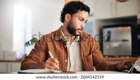 Tablet, reading and remote work with man in kitchen for research, blog writer and news post. Entrepreneur, freelancer and online feedback with person at home for media update, startup and planning
