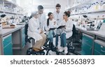 Tablet, science and group of people in laboratory for learning, cancer cure or medical development. Training, investigation and research with scientist team in clinical trial for medicine internship