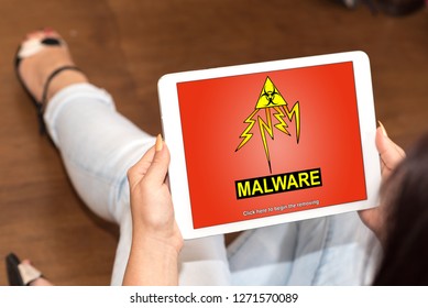 Tablet screen displaying a malware concept