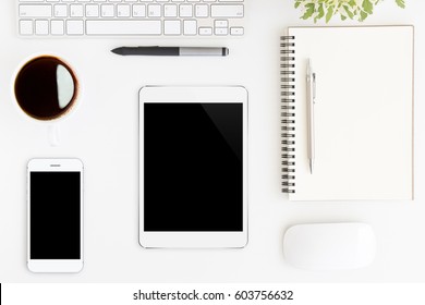 Tablet Showing Blank Screen On White Work Desk Top View