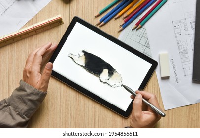 a tablet showing hand sketch the drawing of beagle dog with digital pens pencil draft paper and equipment on wood table, the concept of new technology for drawing and rendering of tablet