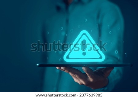 tablet shows a warning sign of system failure. concept notification a spam, risk of website technology digital online. caution danger if a computer is attacked cyber error symbol, leak software data