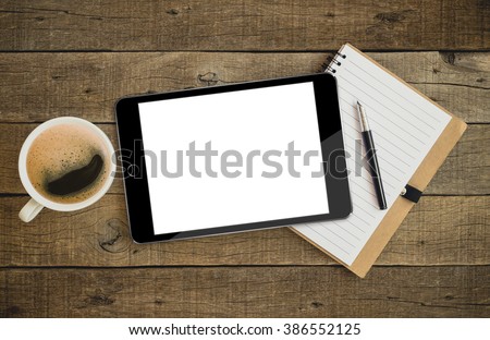 tablet similar to ipades style on wood desk on top view