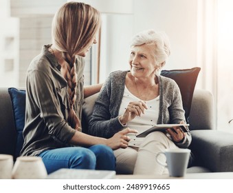 Tablet, sofa and woman with senior mother in home for help with online blog, internet or connectivity. Bonding, teaching and elderly female person learning digital technology with daughter at house. - Powered by Shutterstock