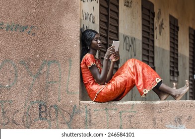 Tablet Technology: African Ethnicity Girl Studying For Exam In Mali 