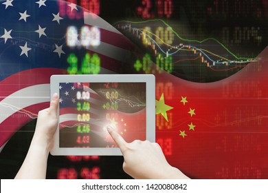 Tablet Using For Stock Market Data On USA And China Trade War Economy With Business Planning Analysis By Online Technology. Finger Press At Tablet With Online Internet On USA China Trade War Economy.