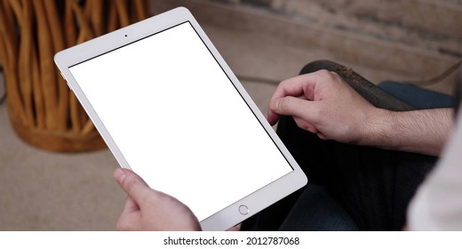 A Tablet With White Empty Screen, Close Up On Man's Hands While Holding An Apple IPad With Blank Touchscreen.