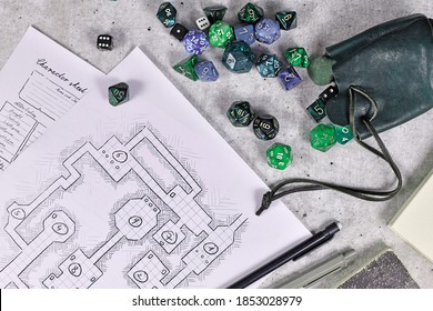 Tabletop Role Playing Flat Lay With RPG Game Dices, Character Sheet,dungeon Map And Pen On Wooden Desk