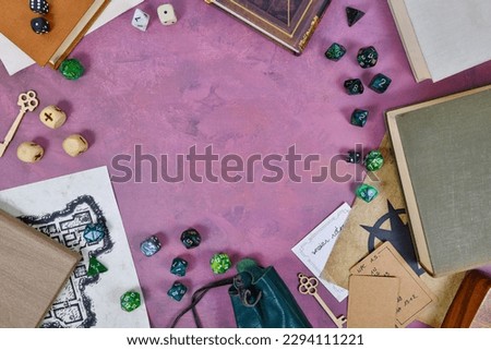 Tabletop role playing flat lay background with colorful RPG dices, rule books, dungeon map 