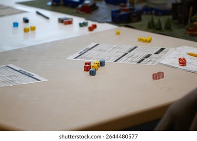 Tabletop wargaming with character sheet and dice on table. 