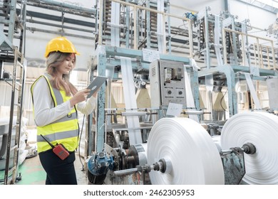 Tablets empower Asian female engineers to work efficiently and flexibly within factories and industrial settings, whether they are on the factory floor, in the design studio, or collaborating - Powered by Shutterstock