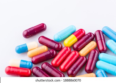 Tablets pills capsule heap mix therapy drugs, over a white background - Shutterstock ID 1888860070