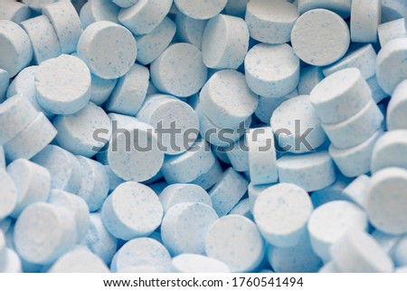 A tabletted catalyst or many unpacked tablets of a chemical.
