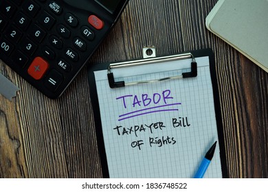 TABOR - Taxpayer Bill of Rights write on a paperwork isolated on Wooden Table. Business or Financial Concept - Shutterstock ID 1836748522