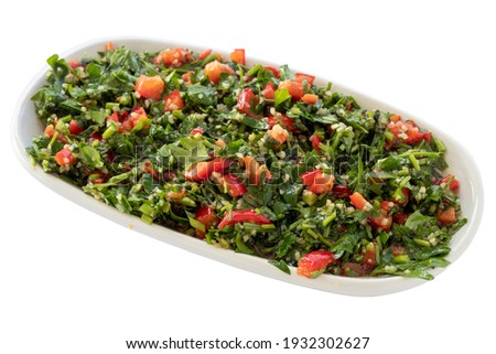 taboule salad appetizer (mezze) isolated on white background. Healthy vegan food. Local name tabule salatası