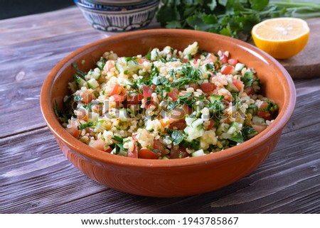 Tabouli Salad or Tabule, Tabbouleh - simple Mediterranean salad with vegetables and bulgur.