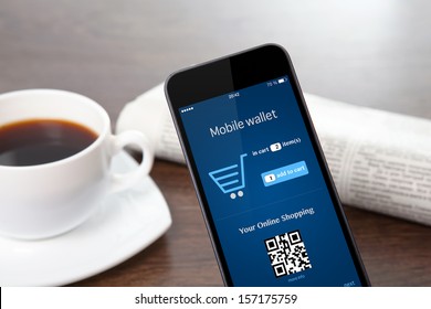 Tach Phone With Mobile Wallet Onlain Shopping On The Screen On A Table At A Businessman In Office