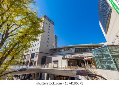 TACHIKAWA, TOKYO / JAPAN - APRIL 4 2019 : Landscape of "Tachikawa Station" south entrance. There are Pedestrian deck and hotel and commercial facilities in front of the station.