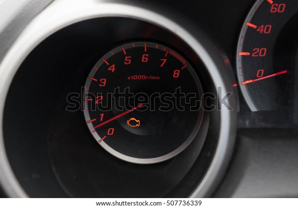 tachometer of a modern car\
engine light