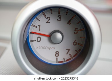 Tachometer in a silver pod
