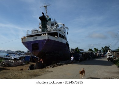 TACLOBAN, PHILIPPINES - Aug 27, 2014: A Boat From Cebu On The Land By The Haiyan Or Yolanda Storm, In Tacloban City