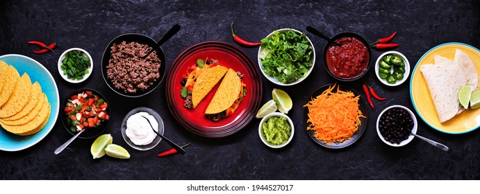 Taco Bar Table Scene With A Selection Of Ingredients. Top View On A Dark Slate Banner Background. Mexican Food Buffet.