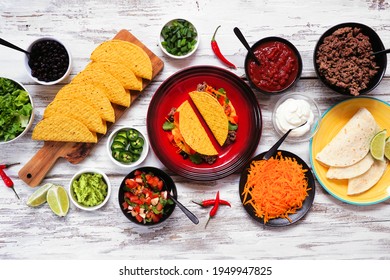 Taco Bar Table Scene With A Variety Of Ingredients. Above View On A Rustic White Wood Background. Mexican Food Buffet.