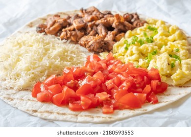 Taco With Chipotle Chicken, Tomato, Cheese And Eggs