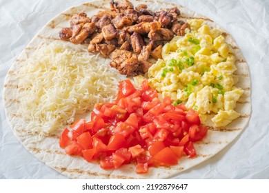 Taco With Chipotle Chicken, Tomato, Cheese And Eggs