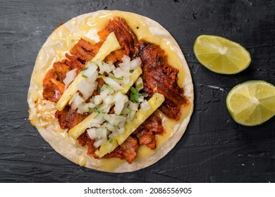 taco de pastor in black background - Shutterstock ID 2086556905