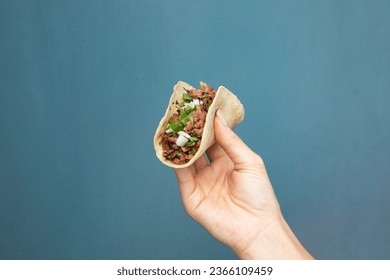 Taco held up in the air