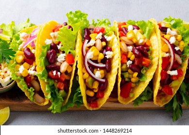 Taco With Mixed Vegetables, Beans On Cutting Board. Grey Background. Close Up.