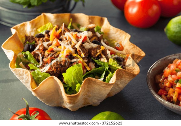 Taco Salad in a Tortilla Bowl with Beef Cheese\
and Lettuce