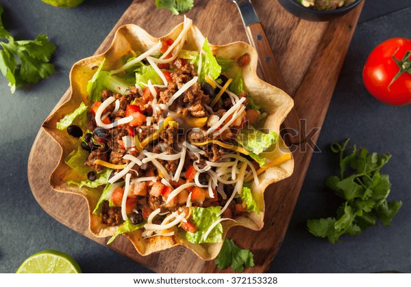 Taco Salad in a Tortilla Bowl with Beef Cheese\
and Lettuce