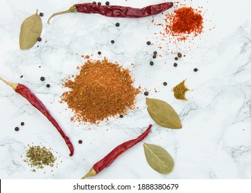 Taco Spice Mix Overhead Shoot With Red Pepper Black Pepper Bay Leaf On White Marble Look Background