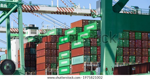 Tacoma, WA, USA - May 16, 2021 - Container ship\
Ever Lucky loading at the Port of Tacoma in preparation for\
departure to Kaohsiung,\
Taiwan