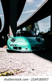 Tacoma, WA, USA
November 2, 2021
RWB Porsche 911 Parked Under A Overpass With A Shadow Being Cast On The Car