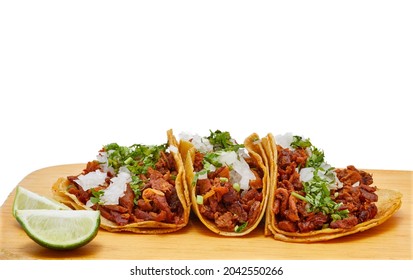 Tacos al pastor, traditional Mexican food, with onion, cilantro, pineapple, red sauce or guacamole.