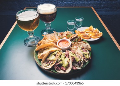 Tacos Beer And Mezcal In Dark Mood Lighting