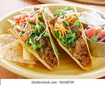 Tacos on a platter with tortillas shot with natural light - mexican food
