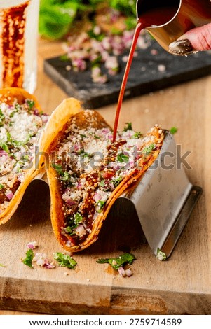 Tacos. Pulled pork tacos served in soft, homemade tortillas, filled with tender, slow-cooked pork and topped with creamy queso cheese and a fresh cilantro lime sauce. Accompanied by a spicy margarita, this vibrant dish pairs rich, savory flavors with bright citrus and a hint of heat. Styled in natural light with a focus on texture and color, the image highlights juicy pork, warm tortillas, and refreshing cocktail presentation, ideal for concepts of Mexican cuisine, street food, casual dining, gourmet tacos, and modern comfort food.