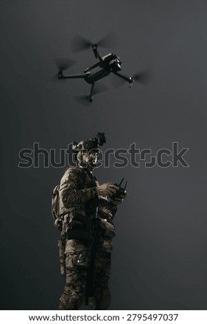 Tactical drone operator controlling UAV during covert military reconnaissance, soldier in camouflage using remote controller under flying quadcopter with dark copy space. Vertical