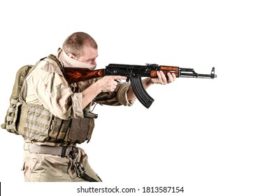 Tactical Mercenary Armed With Old Soviet Wooden Rifle Aiming To The Right. His Gear Is Bullet Proof Vest With Small Backpack Behind Him, Several Magazine Pouches. Isolated, White Background.