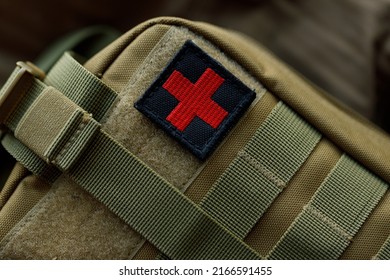 Tactical Military First Aid Kit With Red Cross Chevron Close Up 