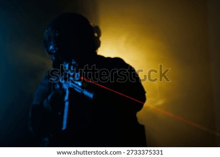 A tactical operator under dramatic lighting, holding a firearm with a vivid red laser beam, creating a sense of intensity and focus in a night operation or strategic training atmosphere.