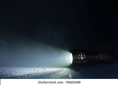 Tactical waterproof flashlight with waterdrops and smoke