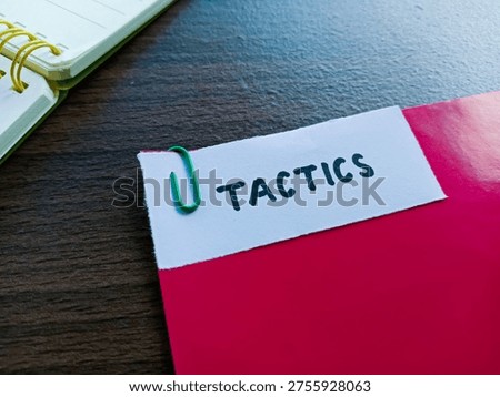 Tactics writting on table background. 