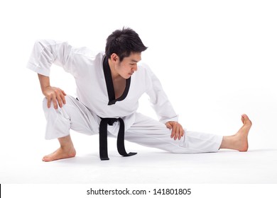 Taekwondo Action Isolated By A Young Man